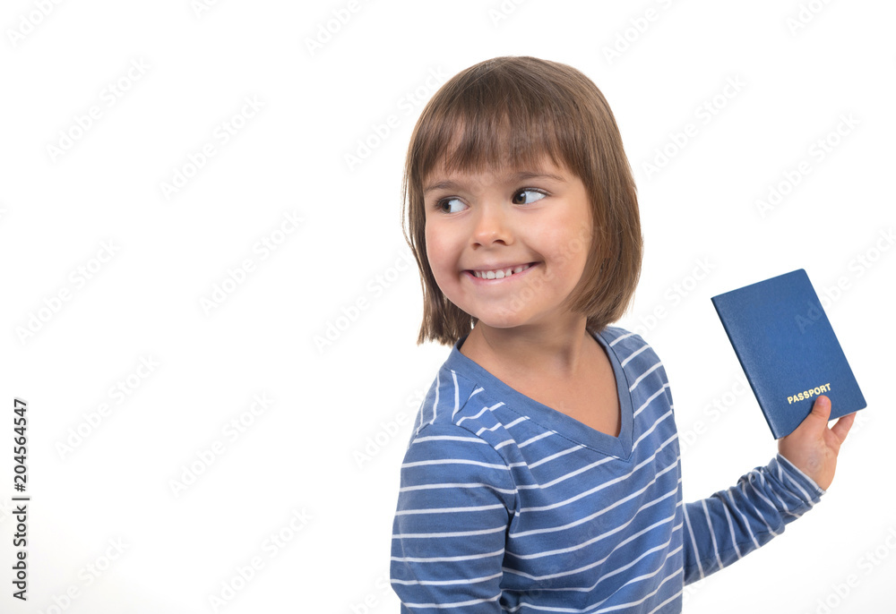 The small cheerful child with the passport in a hand looks aside on the white isolated background. The small cheerful child with the passport in a hand looks aside on the white isolated background.