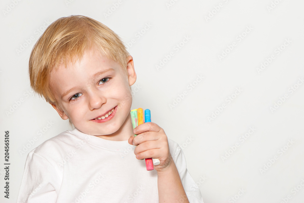 The little schoolboy on a light background The little schoolboy on a light background