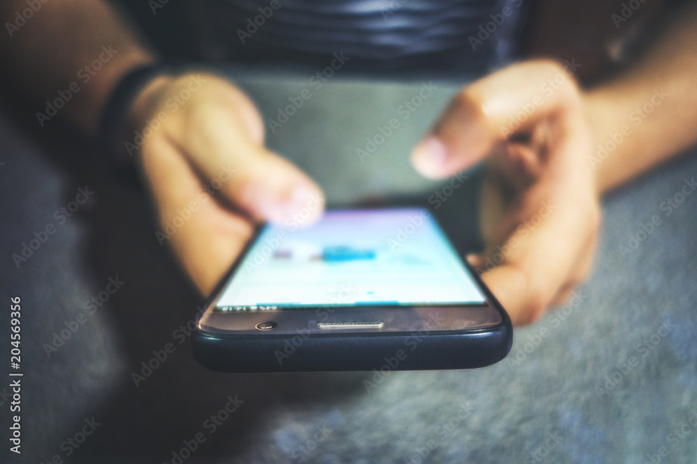 close up of two hands holding a smart phone close up of two hands holding a smart phone