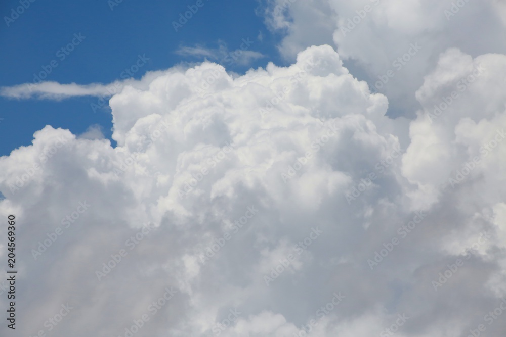 Fluffy Billowy Cumulus Clouds in the Blue Summer Sky in Florida Fluffy Billowy Cumulus Clouds in the Blue Summer Sky in Florida