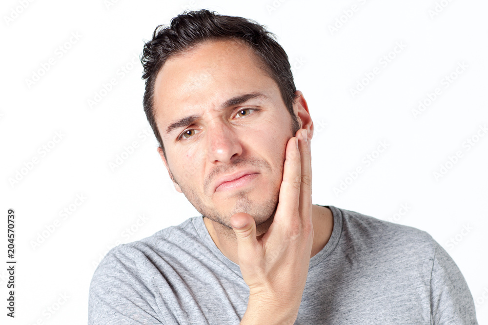 Man in gray T-shirt with toothache on white background Man in gray T-shirt with toothache on white background