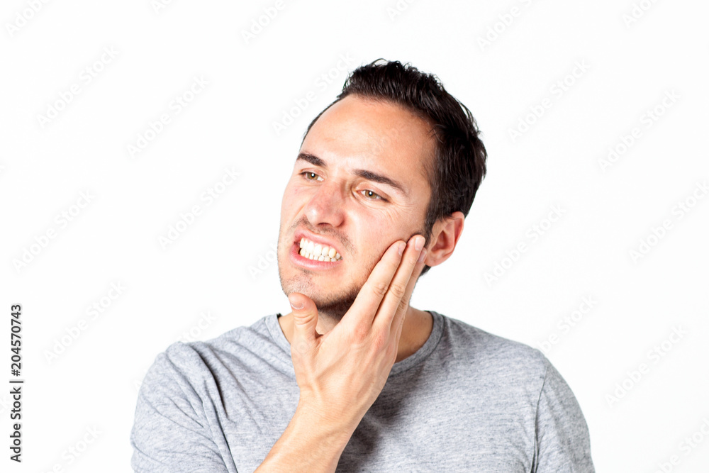 Man in gray T-shirt with toothache on white background Man in gray T-shirt with toothache on white background