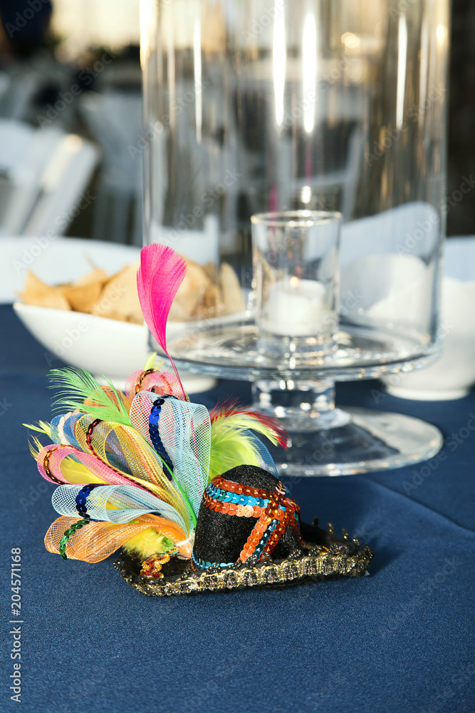 Small Decorative Sombrero and Chips in Front of Candle