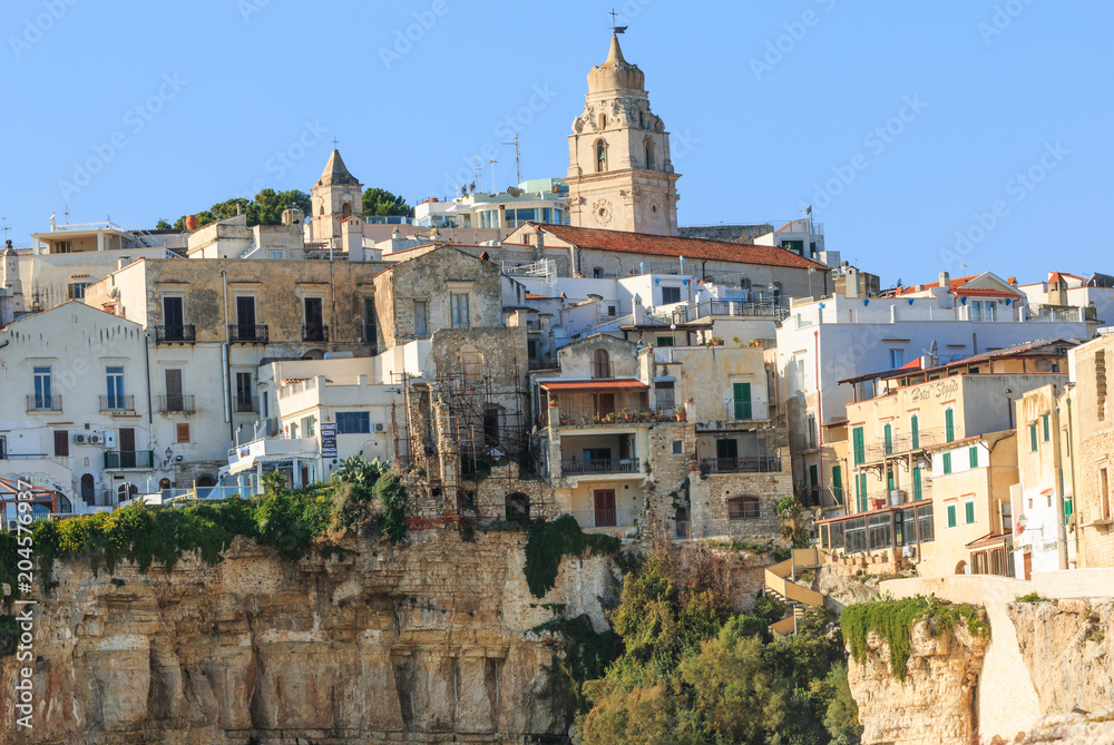 Italy, Foggia, Apulia, SE Italy, Gargano National Park, old town Vieste. White-washed stone houses and Vieste Cathedral's church steeples. Pedestrian-only streets.