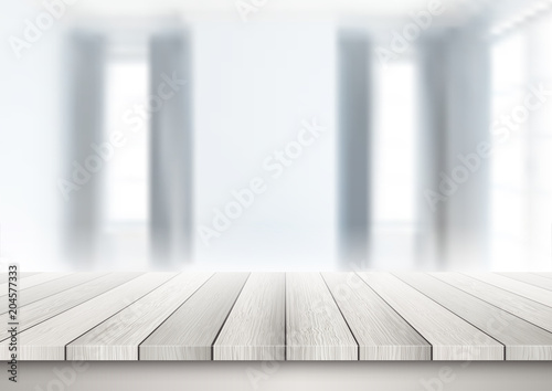 Wooden table looking out to a defocussed room interior