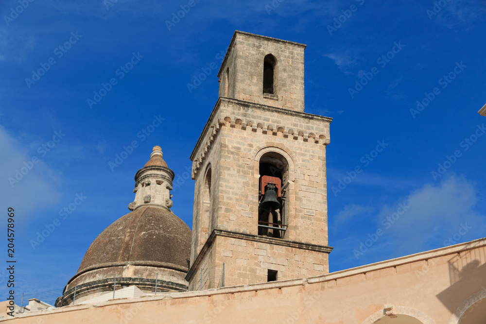 Italy, southern Italy. Puglia. Small comune of the Metropolitan City of Bari, Alberobello. UNESCO World Heritage site. Dome and bell tower.