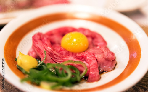 Japanese dish of beef with raw egg, Tokyo, Japan. Close-up.