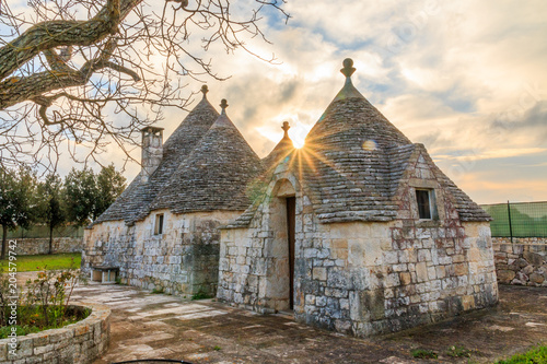 Italy, SE Italy, Region of Apulia, Province of Bari, Itria Valley,  Alberobello. A trullo house is a Apulian dry stone hut with a conical roof. UNESCO Heritage site.  November 24, 2016 photo