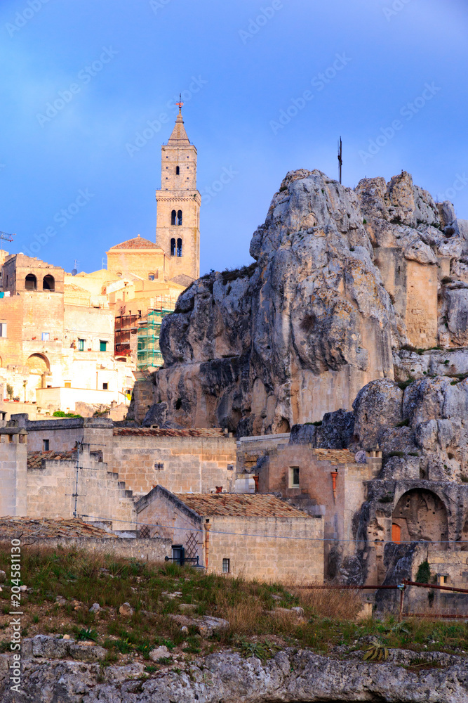 Italy, Southern Italy, Region of Basilicata, Province of Matera, Matera. The town lies in a small canyon carved out by the Gravina. Overview of town. The cave church Madonna de Idris. 