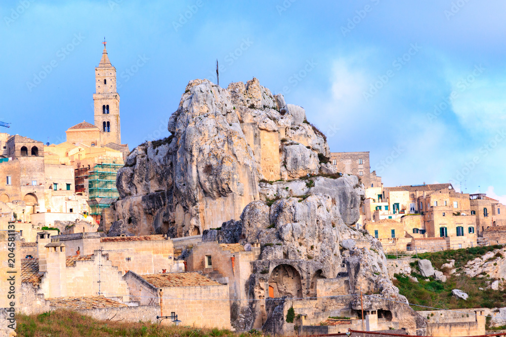 Italy, Southern Italy, Region of Basilicata, Province of Matera, Matera. The town lies in a small canyon carved out by the Gravina. Overview of town. The cave church Madonna de Idris.