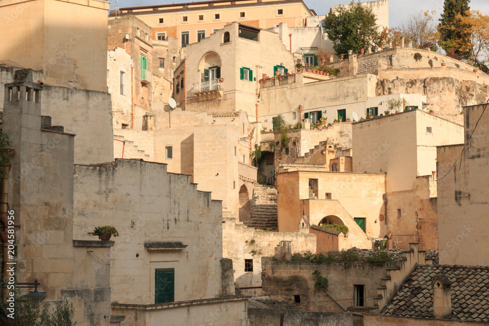 Italy, Southern Italy, Region of Basilicata, Province of Matera, Matera. The town lies in a small canyon carved out by the Gravina. Overview of town.