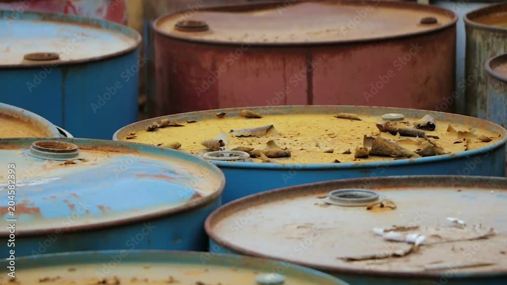 Old rusty barrels with oil products casks Old rusty barrels with oil products casks
