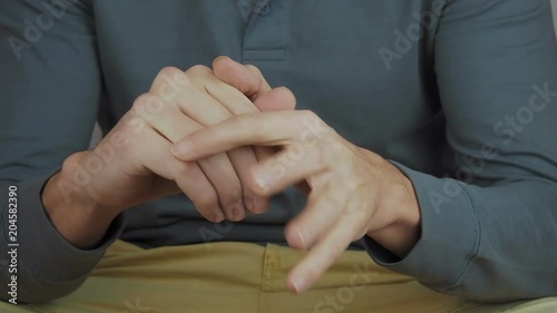 The man is nervous. Hands of a nervous person.
