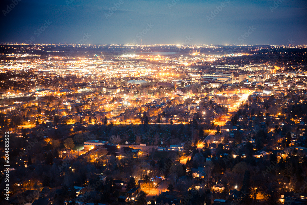 Beautiful Boulder Colorado seen at night from above with many lights across the city