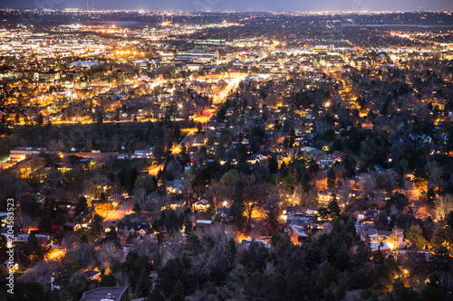 Beautiful Boulder Colorado seen at night from above with many lights across the city