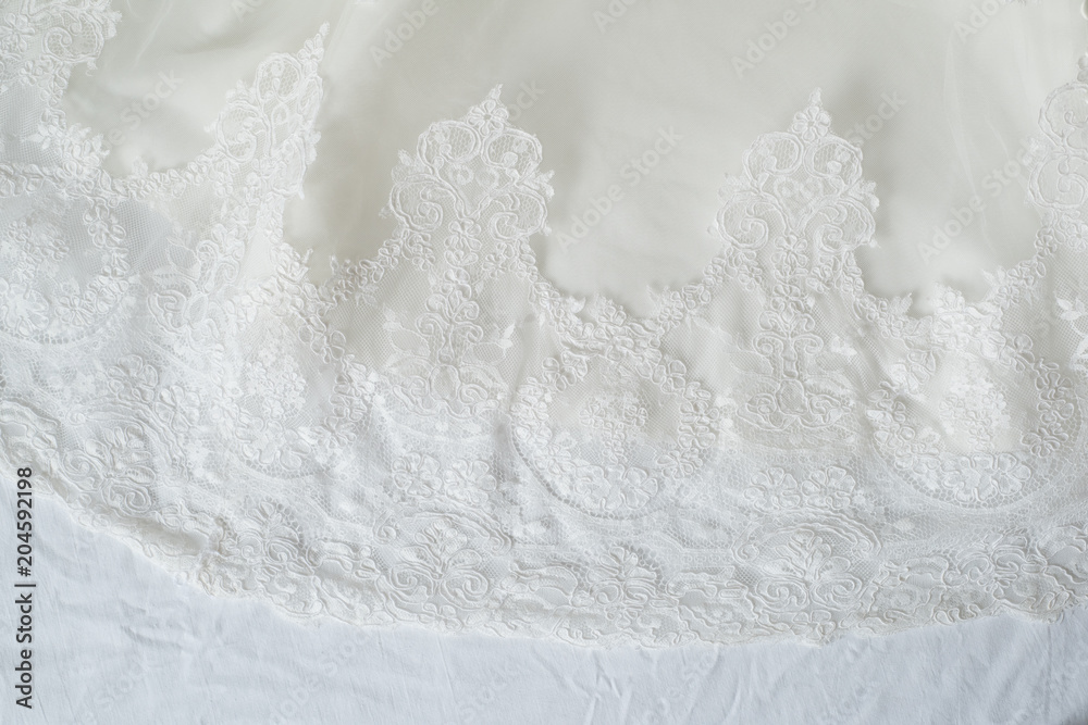 Detail of lace and embroidery in a bride dress