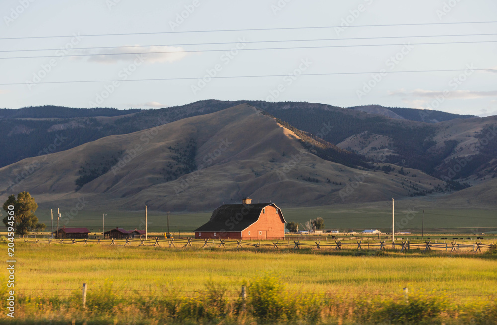 Red Farm House in Rural Farmland Landscape Red Farm House in Rural Farmland Landscape