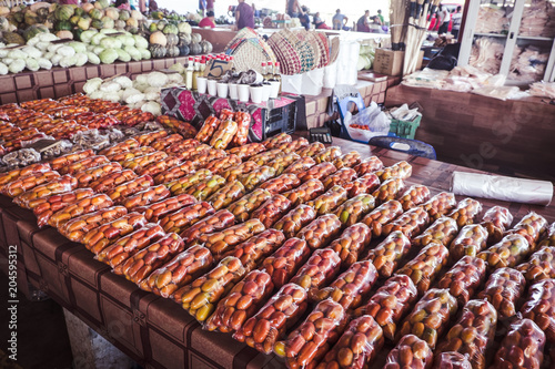 Tomatoes in plastic bags on display at Fugalei fresh produce market, Apia, Samoa, South Pacific