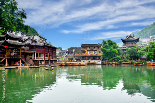 HUNAN, CHINA - JUNE 16, 2014 : Old houses in Fenghuang county in Hunan, China. The ancient town of Fenghuang was added to the UNESCO World Heritage Tentative List in the Cultural category.