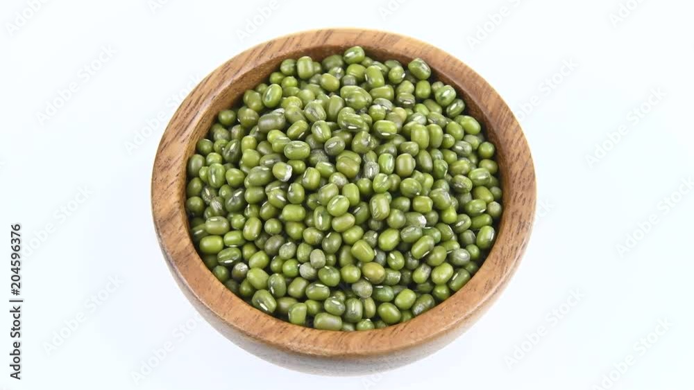 green beans in wood bowl on white. rotation green beans in wood bowl on white. rotation