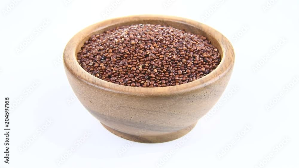 Quinoa in wooden bowl on white background. rotation
Quinoa in wooden bowl on white background. rotation