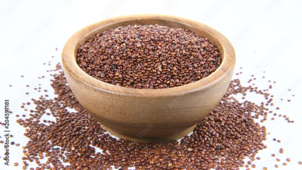 Quinoa in wooden bowl on white background. rotation
Quinoa in wooden bowl on white background. rotation