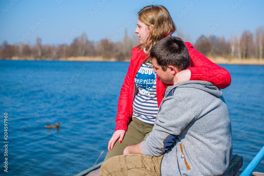 Fototapeta premium Overweight couple in park on sunny day. Concept of young plump people