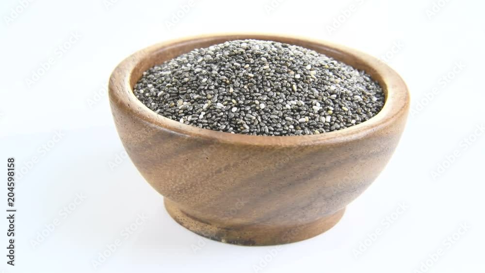 Chia Seed in wood bowl on white background. rotation
Chia Seed in wood bowl on white background. rotation