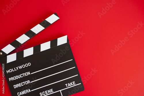 фотографія film clapper on red background