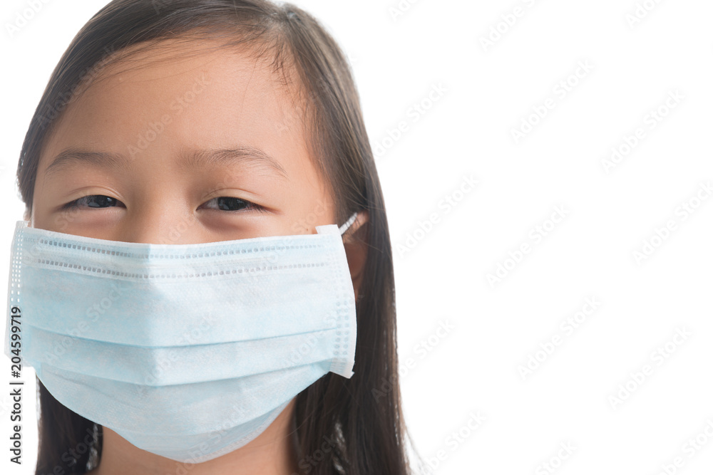 Asian kid girl age 7 years with protection mask against flu virus