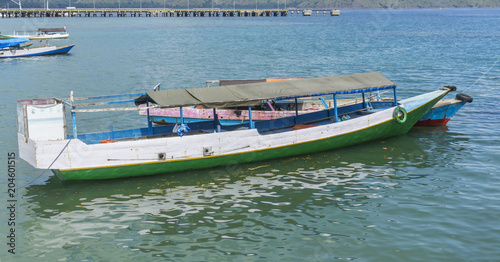 Traditional boat anchored at Komodo Island Indonesia photo