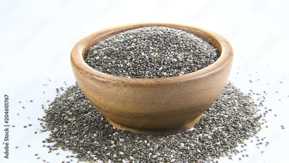 Chia Seed in wood bowl on white background. rotation Chia Seed in wood bowl on white background. rotation