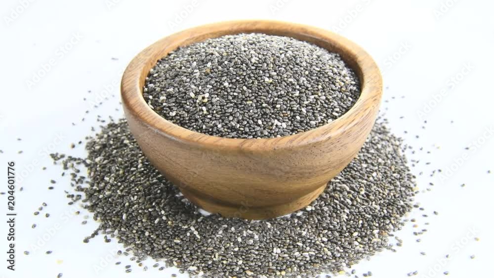 Chia Seed in wood bowl on white background. rotation Chia Seed in wood bowl on white background. rotation