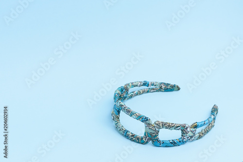 A headband isolated on light blue background.