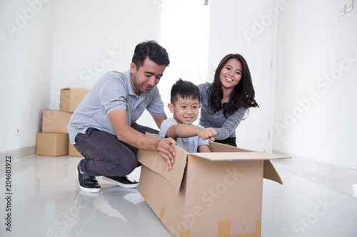 asian family enjoying their new home together