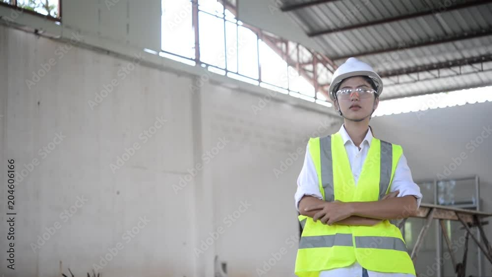 Engineer woman working at site of building under construction Engineer woman working at site of building under construction
