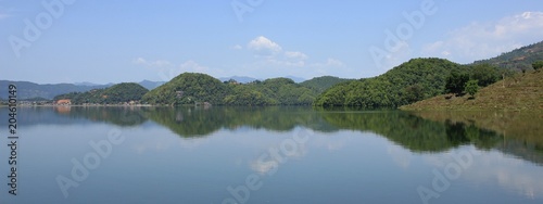 Lake Begnas  beautiful place for swimming. Lake near Pokhara  Nepal. Green hills reflecting on the water.