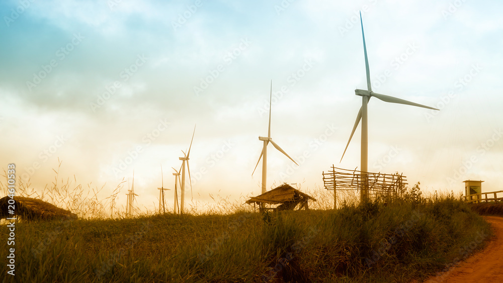 Obraz premium wind turbines at sunset