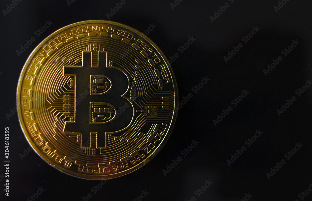 Gold souvenir coin Bitcoin on a black background. Gold souvenir coin Bitcoin on a black background.