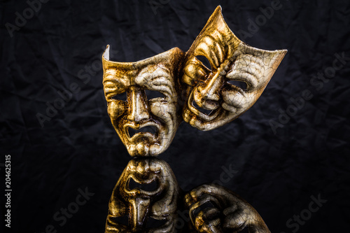 two theatrical masks are good and evil