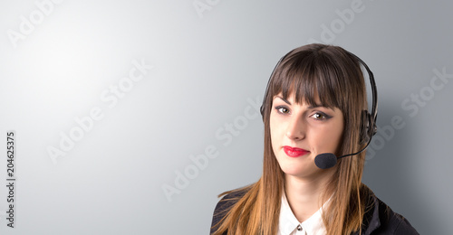 Young female telemarketer on a white background