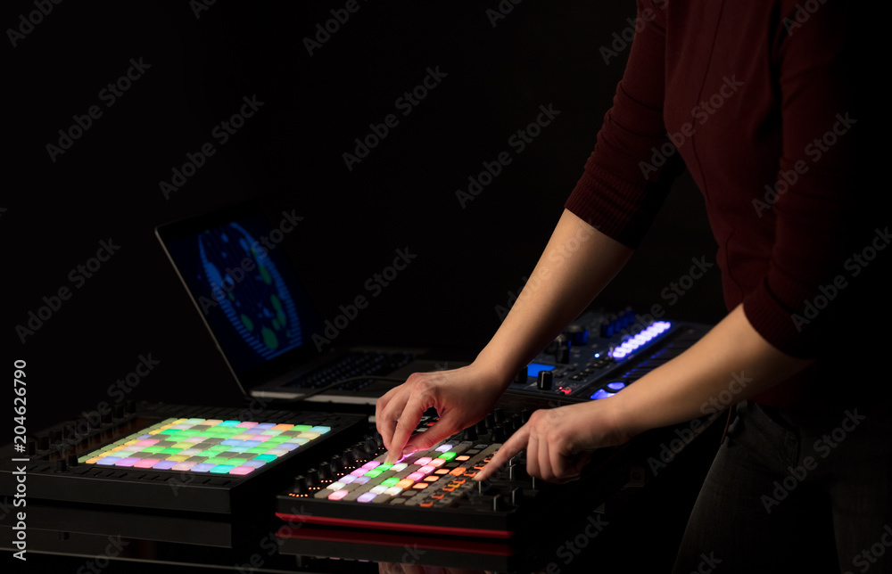Fototapeta premium Dj hand remixing music on midi controller