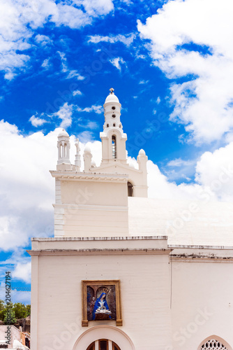 View of the building of the Catholic church against the blue sky in Santo Domingo, Dominican Republic. Copy space for text. Vertical.