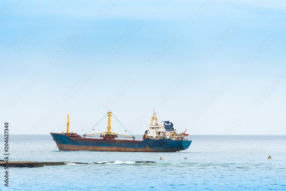 View of a cargo ship in the ocean, Bayahibe, La Altagracia, Dominican Republic. Copy space for text.