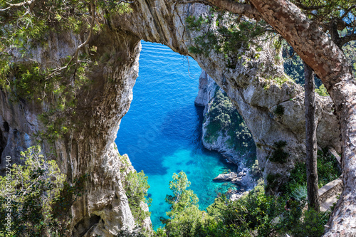 Fototapeta Naklejka Na Ścianę i Meble -  Capri Italy, island in a beautiful summer day, with faraglioni rocks and natural stone arch.