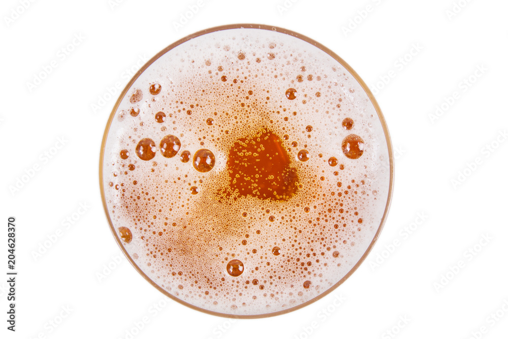 Beer in glass. Lager draft beer foam on white background. View from above. Beer in glass. Lager draft beer foam on white background. View from above.