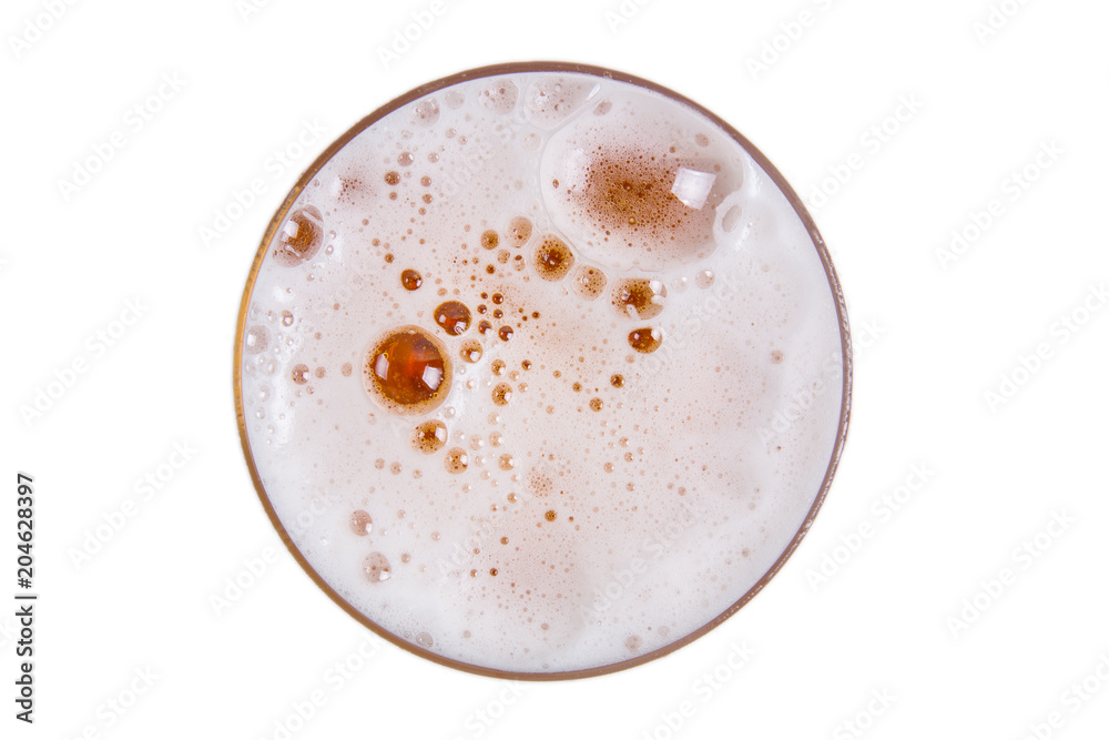 Beer in glass. Lager draft beer foam on white background. View from above. Beer in glass. Lager draft beer foam on white background. View from above.