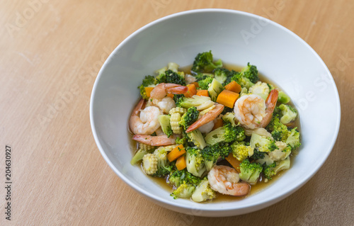 Healthy meal, stir fried vegetables with shrimps. Close up food.