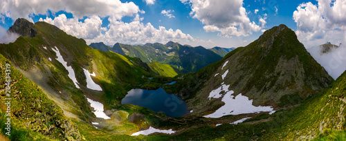 Panorama of Fagaras mountains of Romania. gorgeous landscape with glacier lake Capra, view from above photo
