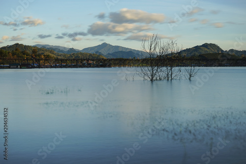 Wallpaper Mural panorama view of Uttamanusorn Bridge or Mon Bridge with river and blue sky in Sangkhlaburi district,Kanchanaburi province,Thailand. Thailand’s longest wooden bridge. Torontodigital.ca